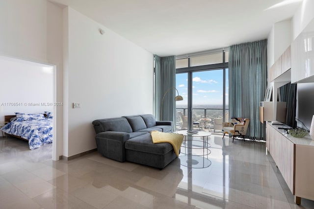 living room featuring a wall of windows