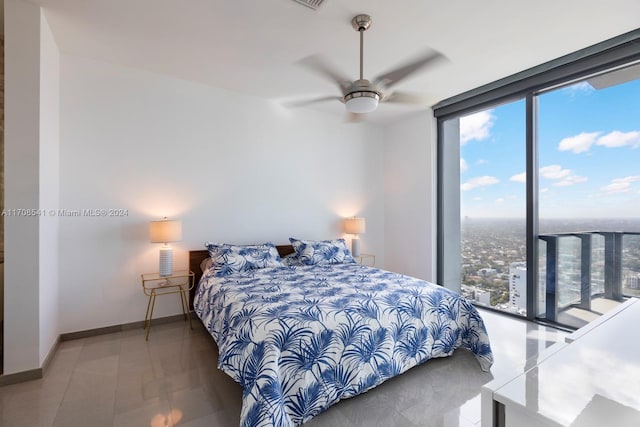 bedroom with ceiling fan and multiple windows