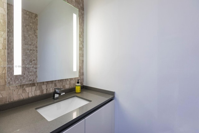 bathroom with vanity and backsplash