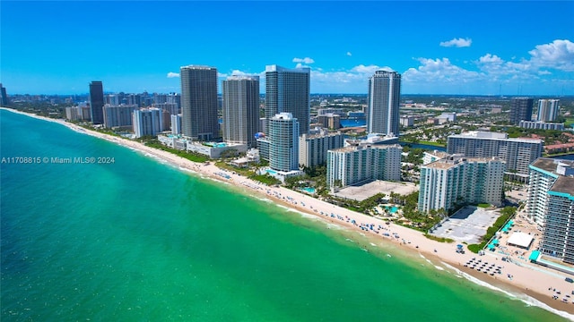 bird's eye view featuring a beach view and a water view