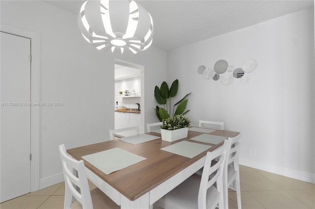 3901 S Ocean Dr Unit 15N, Hollywood, FL 33019 - dining space with light tile patterned flooring and a chandelier