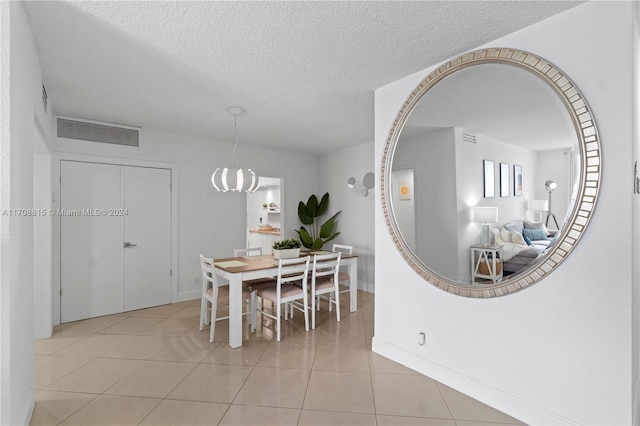 3901 S Ocean Dr Unit 15N, Hollywood, FL 33019 - dining space featuring a textured ceiling and light tile patterned floors