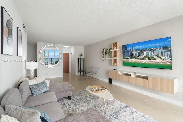 tiled living room with a textured ceiling