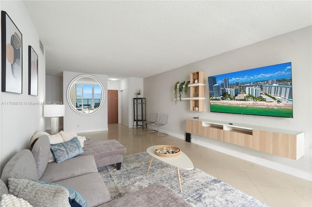 3901 S Ocean Dr Unit 15N, Hollywood, FL 33019 - living area with tile patterned floors and a textured ceiling