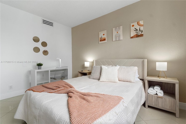 bedroom featuring light tile patterned floors