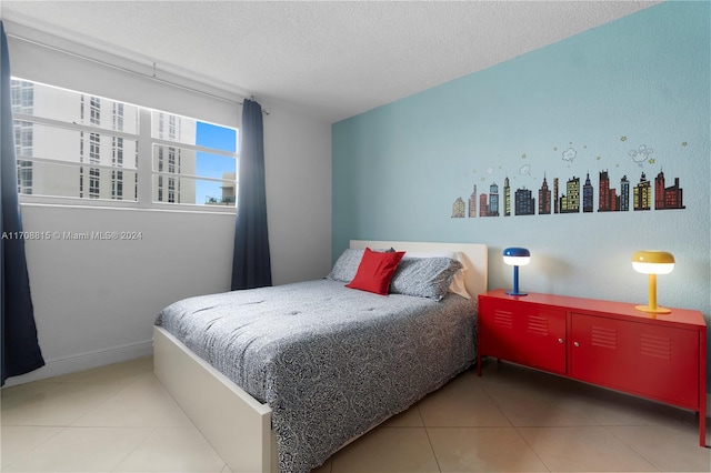 3901 S Ocean Dr Unit 15N, Hollywood, FL 33019 - bedroom featuring tile patterned floors, a textured ceiling, and a view of city