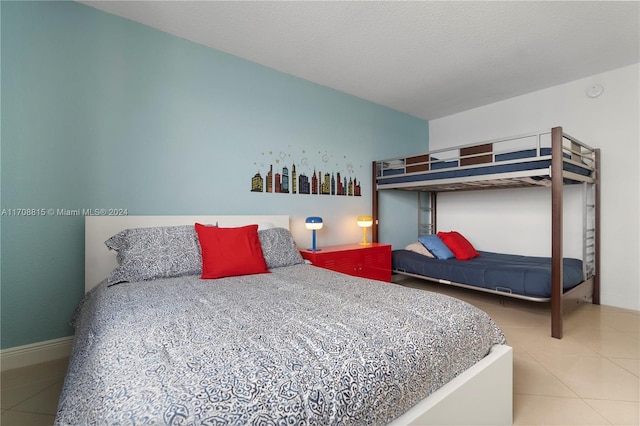 3901 S Ocean Dr Unit 15N, Hollywood, FL 33019 - tiled bedroom featuring baseboards
