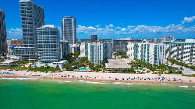 drone / aerial view featuring a view of the beach and a water view