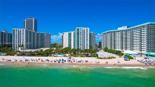 aerial view featuring a water view and a beach view