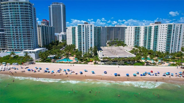 bird's eye view featuring a beach view and a water view