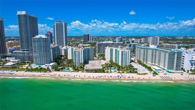 aerial view with a beach view and a water view