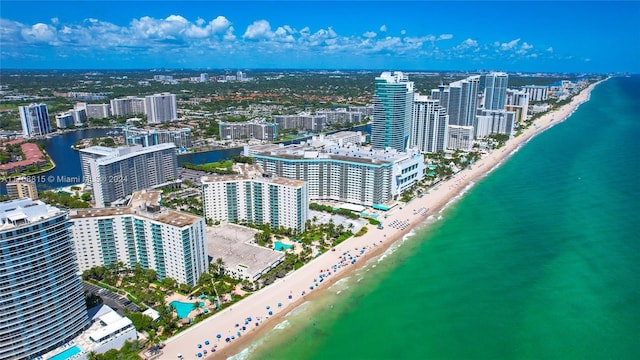 bird's eye view featuring a view of the beach and a water view