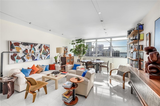 living room featuring a wall of windows