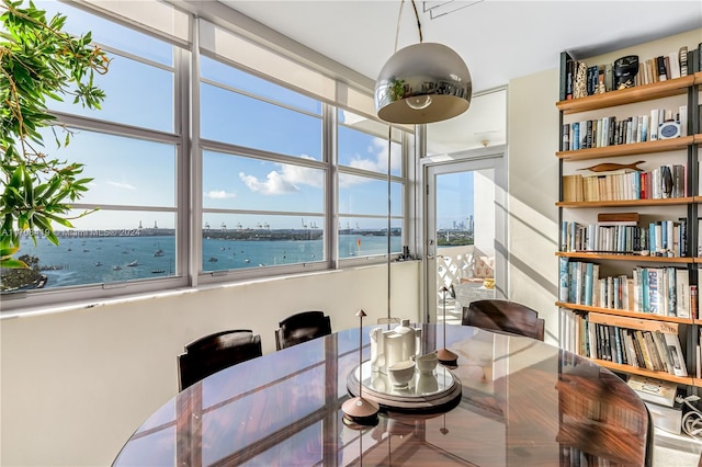 dining room featuring a water view