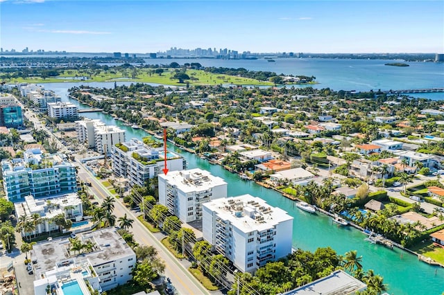 drone / aerial view featuring a water view and a city view