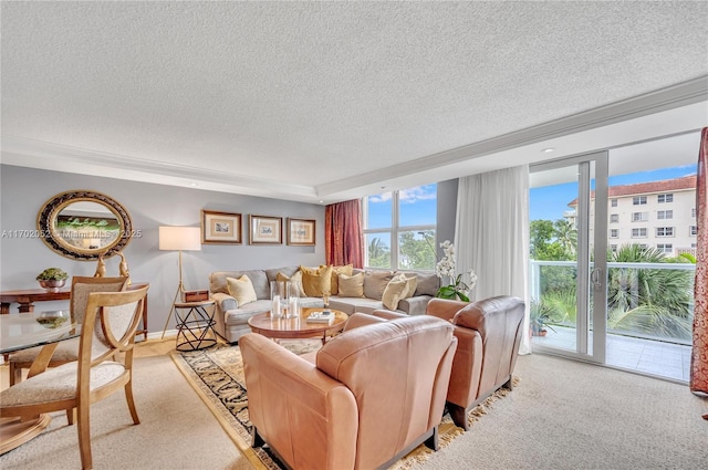 living room with crown molding, a textured ceiling, and light colored carpet
