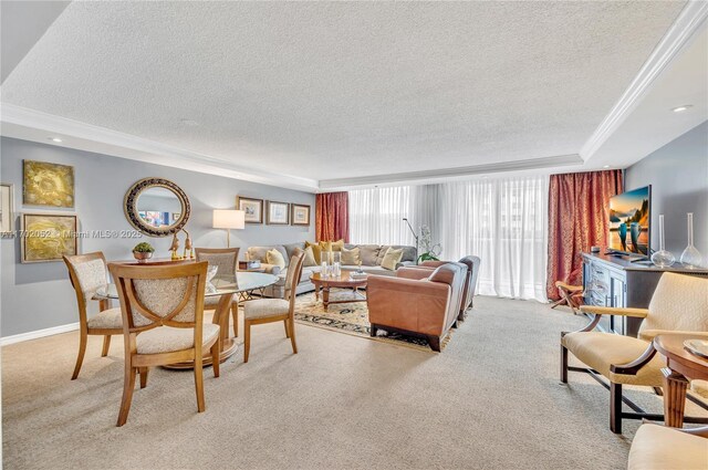 carpeted living area with ornamental molding, a tray ceiling, and a textured ceiling