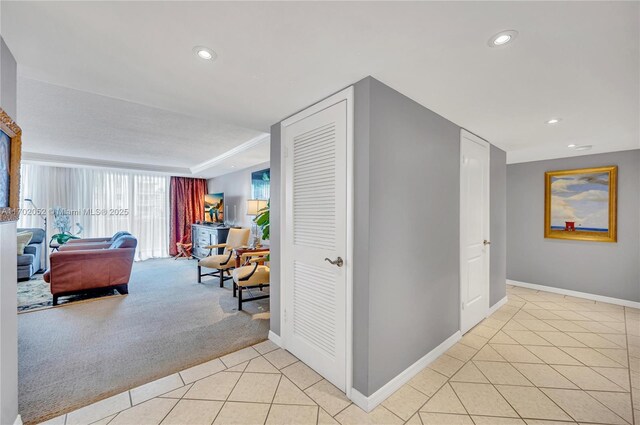 10000 W Bay Harbor Dr Unit 401, Bay Harbor Islands, FL 33154 - hall featuring baseboards, recessed lighting, light tile patterned floors, and light carpet