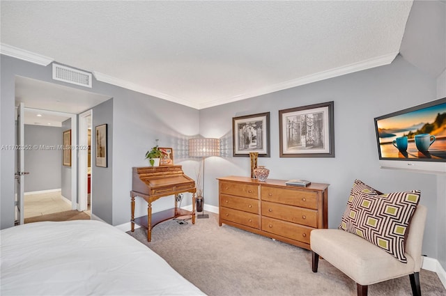 bedroom featuring a textured ceiling, light colored carpet, and crown molding