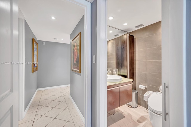 bathroom featuring tile patterned floors, vanity, and toilet