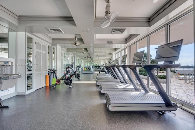 workout area featuring ornamental molding