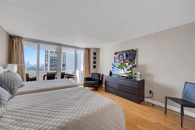 bedroom with light wood-type flooring