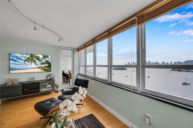 sunroom / solarium with a water view