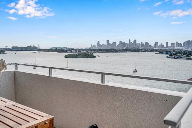 balcony featuring a water view