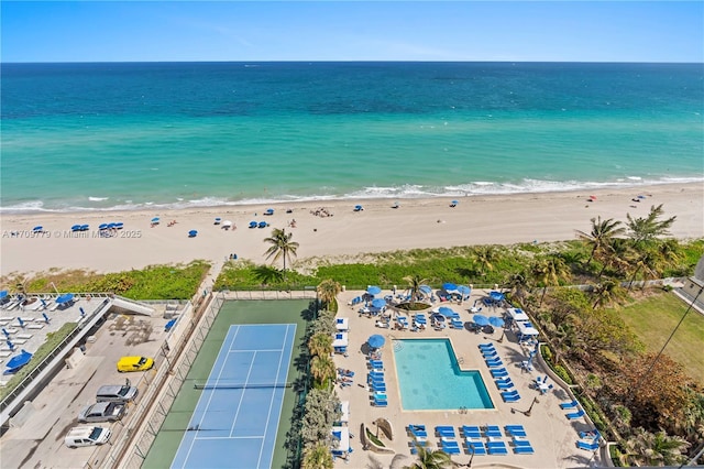 aerial view featuring a view of the beach and a water view