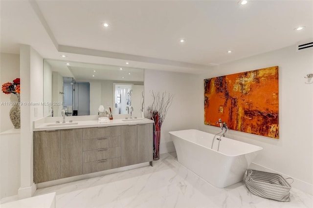 bathroom with a bathtub and vanity