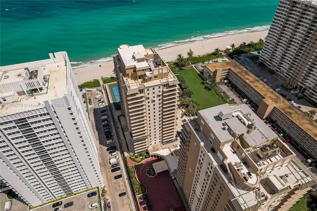 bird's eye view with a water view and a view of the beach