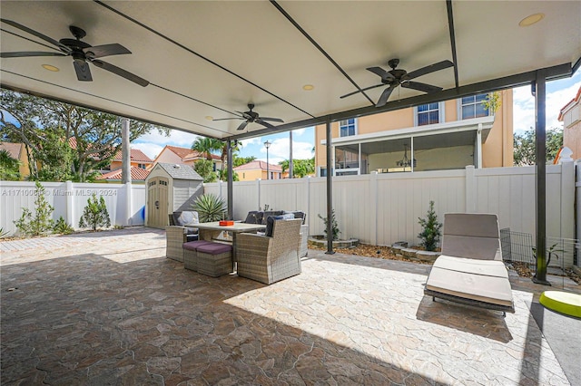 view of patio featuring a shed and ceiling fan