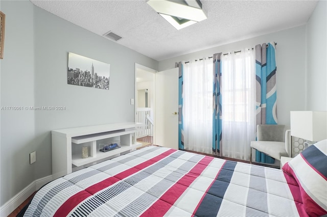 bedroom featuring a textured ceiling