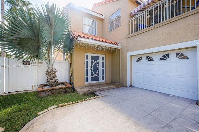 view of exterior entry featuring a garage