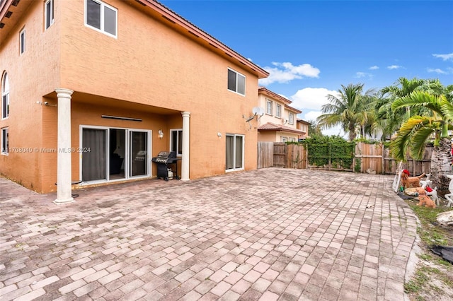 rear view of property featuring a patio