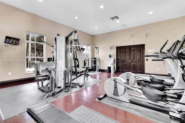 workout area featuring hardwood / wood-style floors