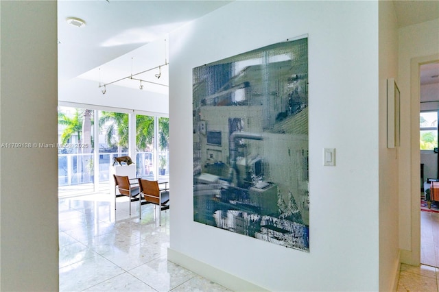 6103 Aqua Ave Unit 301, Miami Beach, FL 33141 - hall featuring plenty of natural light and tile patterned floors