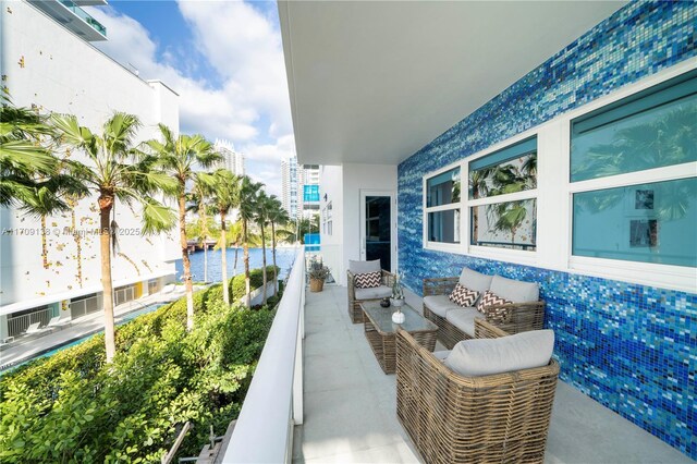 6103 Aqua Ave Unit 301, Miami Beach, FL 33141 - balcony featuring outdoor lounge area and a water view