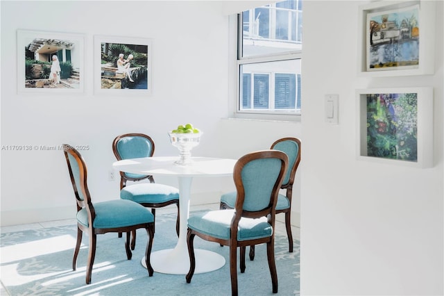 6103 Aqua Ave Unit 301, Miami Beach, FL 33141 - dining space with baseboards