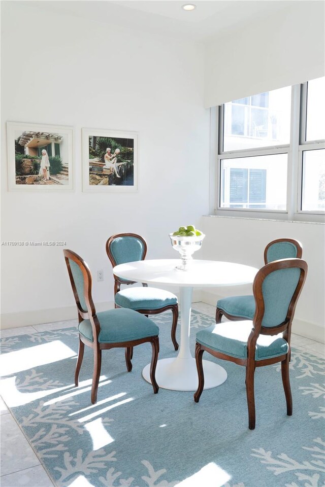 dining space featuring tile patterned flooring