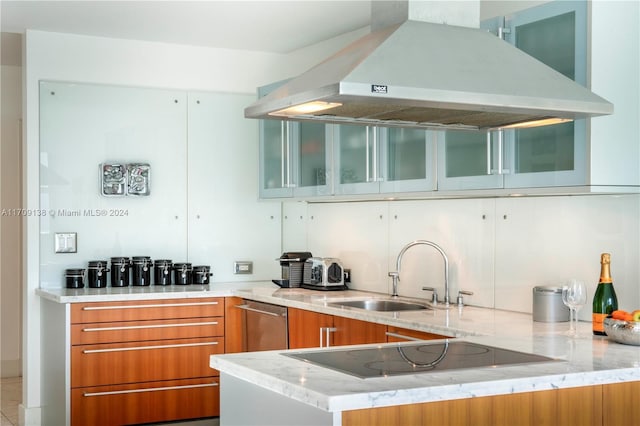 kitchen with sink, stainless steel dishwasher, light stone countertops, range hood, and kitchen peninsula