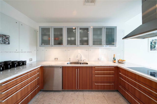 6103 Aqua Ave Unit 301, Miami Beach, FL 33141 - kitchen with wall chimney exhaust hood, dishwasher, brown cabinetry, light stone counters, and glass insert cabinets
