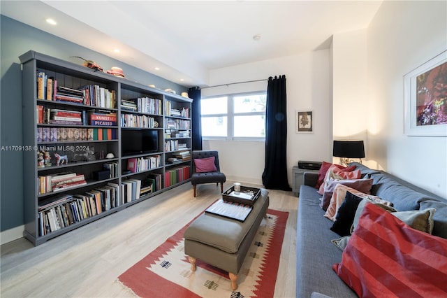 sitting room with hardwood / wood-style floors