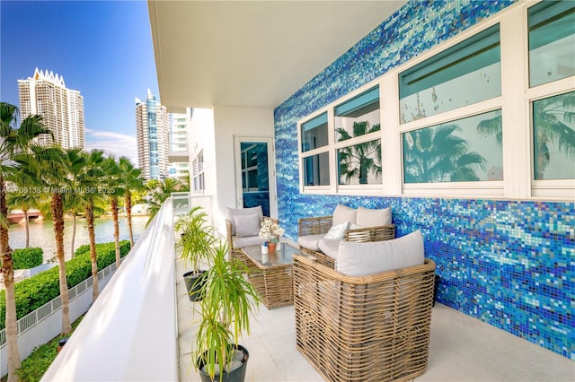 6103 Aqua Ave Unit 301, Miami Beach, FL 33141 - balcony featuring a water view and an outdoor hangout area