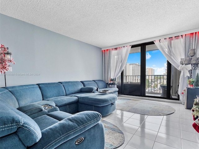 living room featuring tile patterned flooring and a textured ceiling