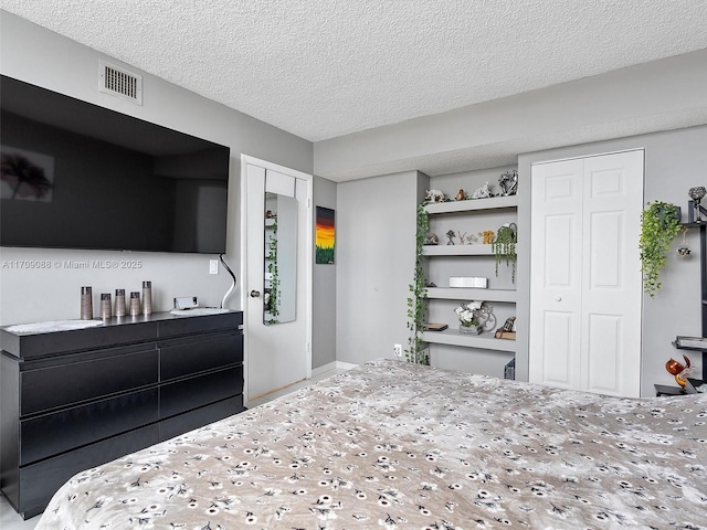 2401 S Ocean Dr Unit 605, Hollywood, FL 33019 - bedroom with a textured ceiling and two closets