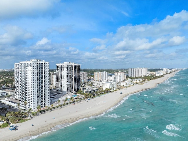 bird's eye view with a water view and a view of the beach