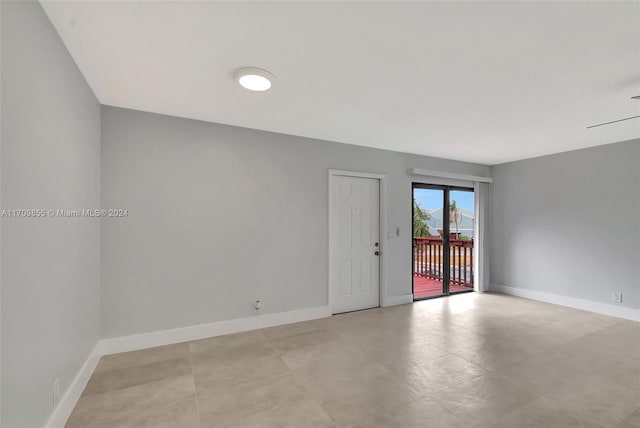 spare room with ceiling fan