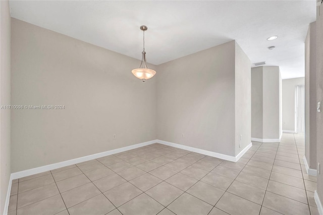 empty room with light tile patterned floors