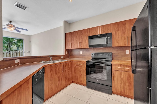 kitchen featuring tasteful backsplash, ceiling fan, sink, black appliances, and light tile patterned floors